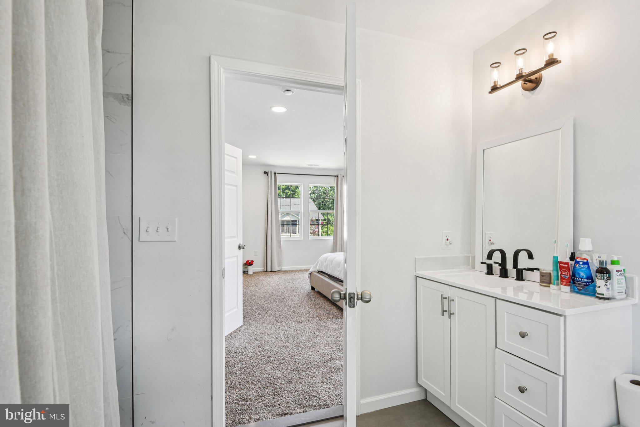 6715 Westcott Road Falls Church, VA 22042 - Photo 10 of 20 a en suite bathroom with a sink double vanity