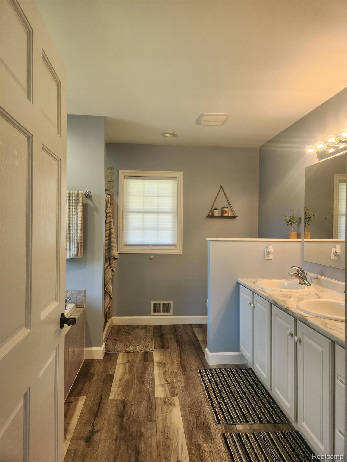 1900 East Marr Road Howell, MI 48855 - Photo 25 of 48 Primary bathroom w/spa tub, shower, 2 sink vanity