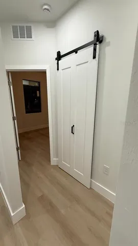 a view of an empty room with a fireplace