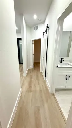 a view of a hallway with front door