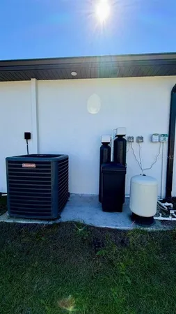 a view of a house with a small yard and a large window