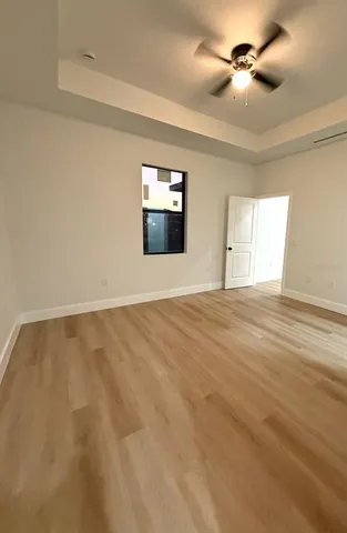 a view of an empty room and a window