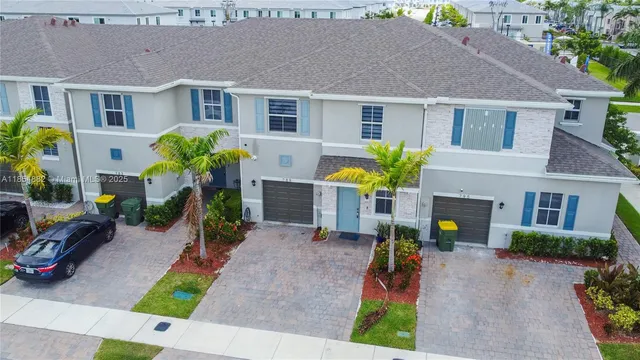 a front view of house with yard outdoor seating and green space