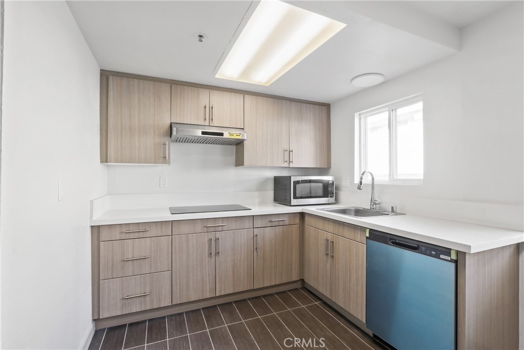 112 North Primrose Avenue, Unit C Alhambra, CA 91801 - Photo 3 of 8 a kitchen with a sink stove and cabinets
