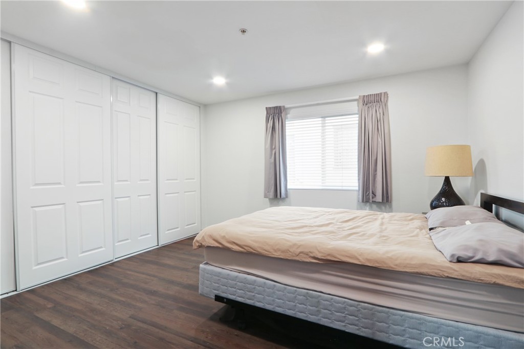112 North Primrose Avenue, Unit C Alhambra, CA 91801 - Photo 7 of 8 a bedroom with a bed and a window