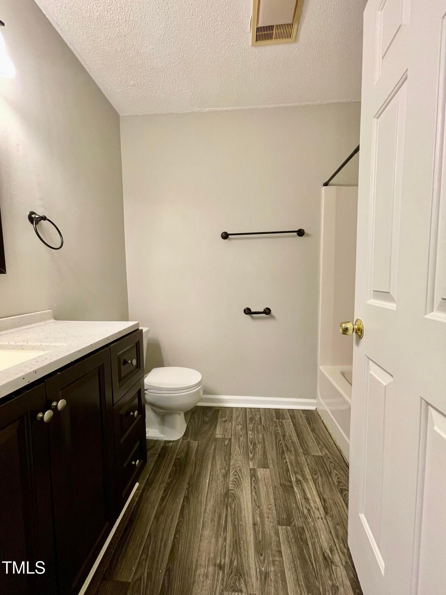 4114 Beechnut Lane Durham, NC 27707 - Photo 19 of 25 a bathroom with a sink and a mirror