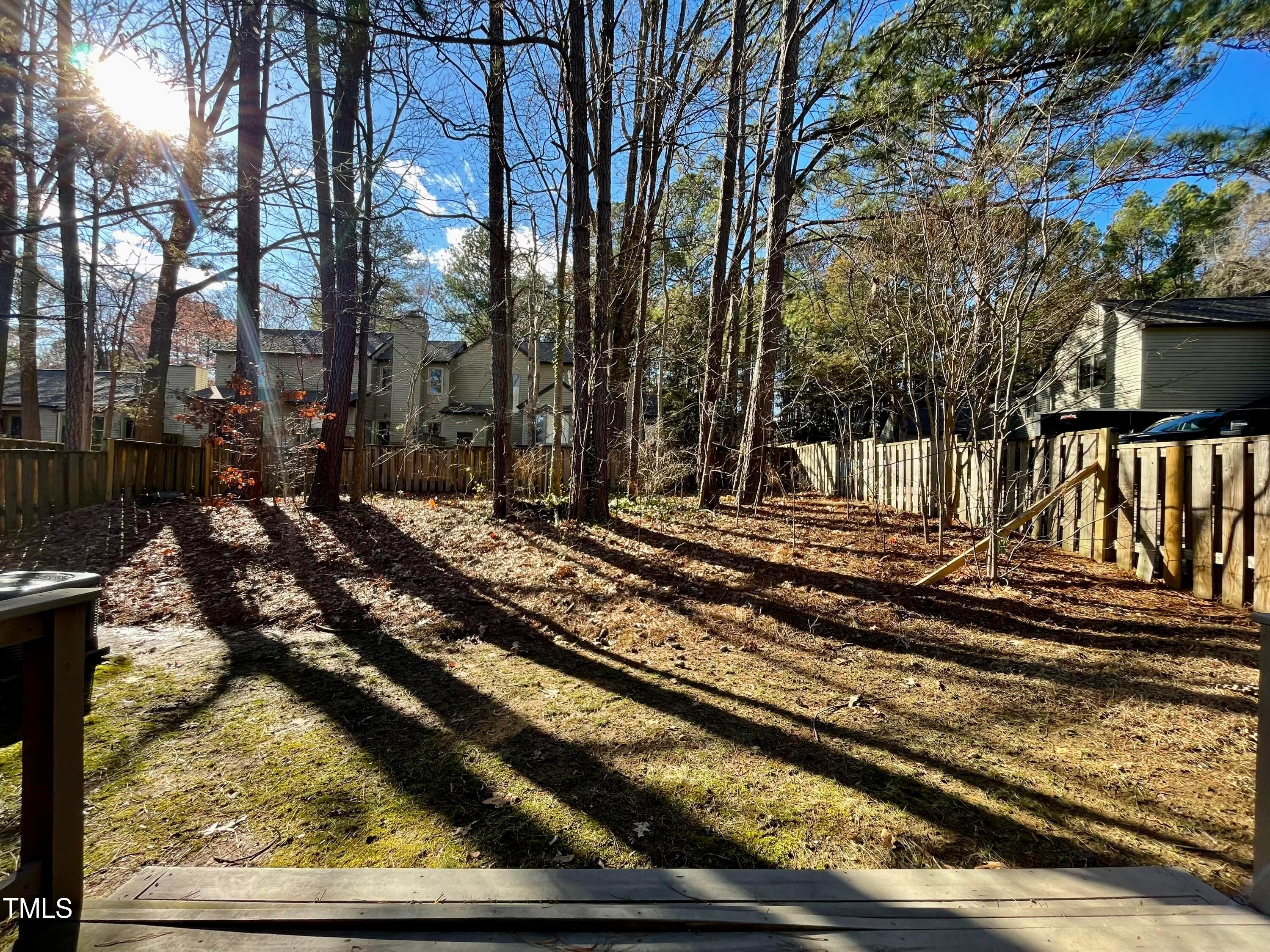 4114 Beechnut Lane Durham, NC 27707 - Photo 24 of 25 a view of a yard with wooden fence