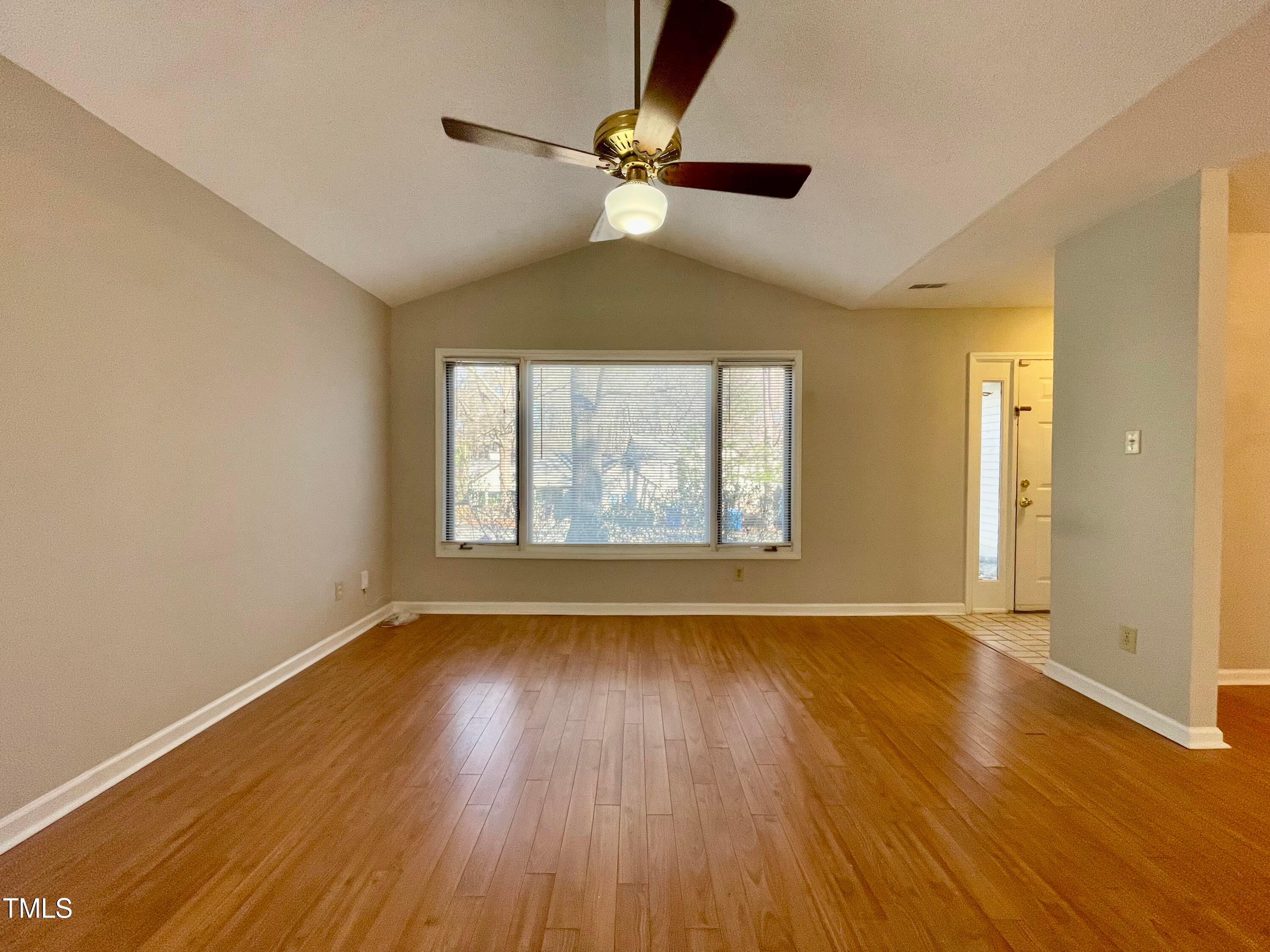 4114 Beechnut Lane Durham, NC 27707 - Photo 4 of 25 wooden floor in an empty room with a window