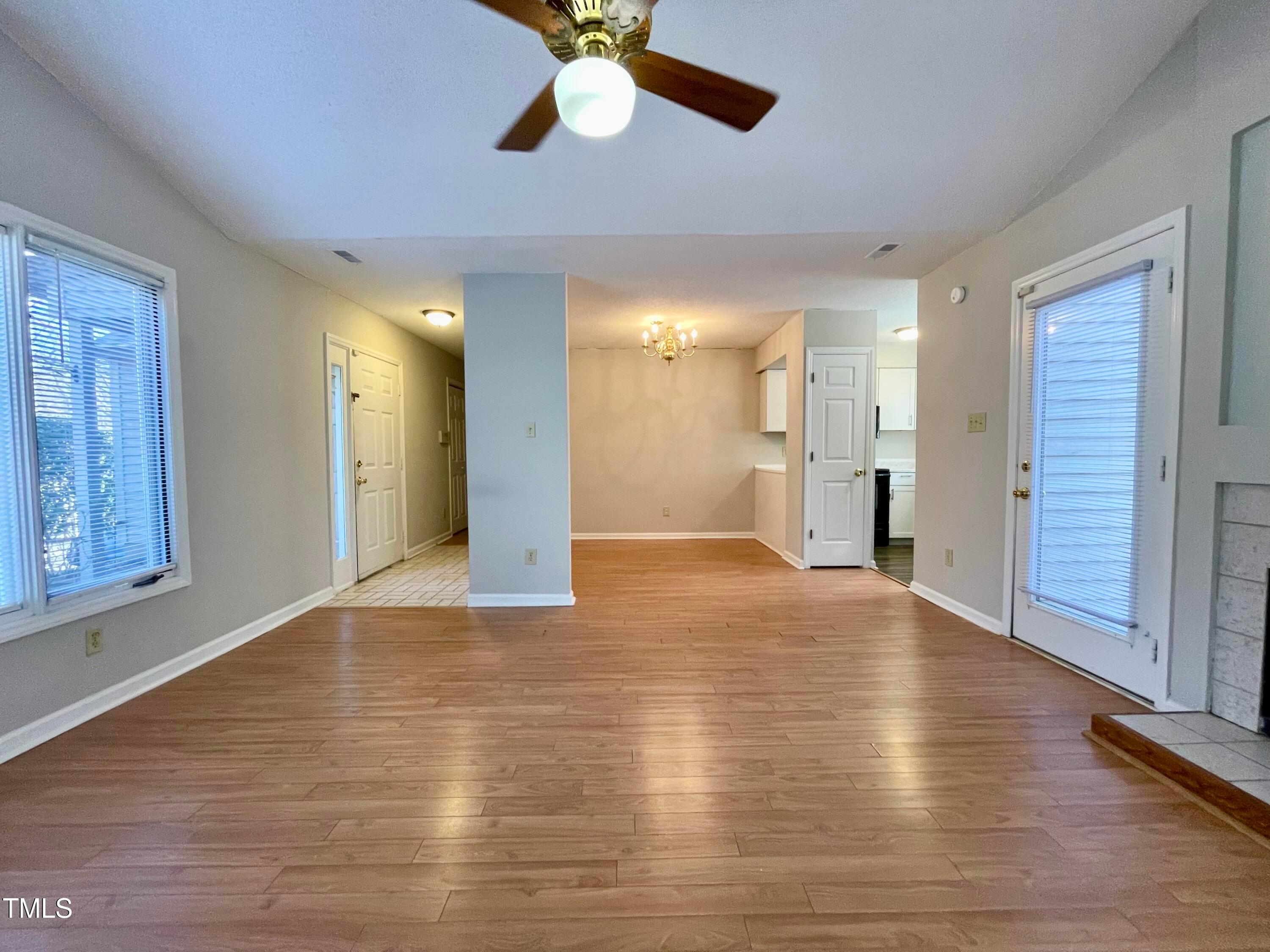 4114 Beechnut Lane Durham, NC 27707 - Photo 5 of 25 a view of empty room with wooden floor and fan