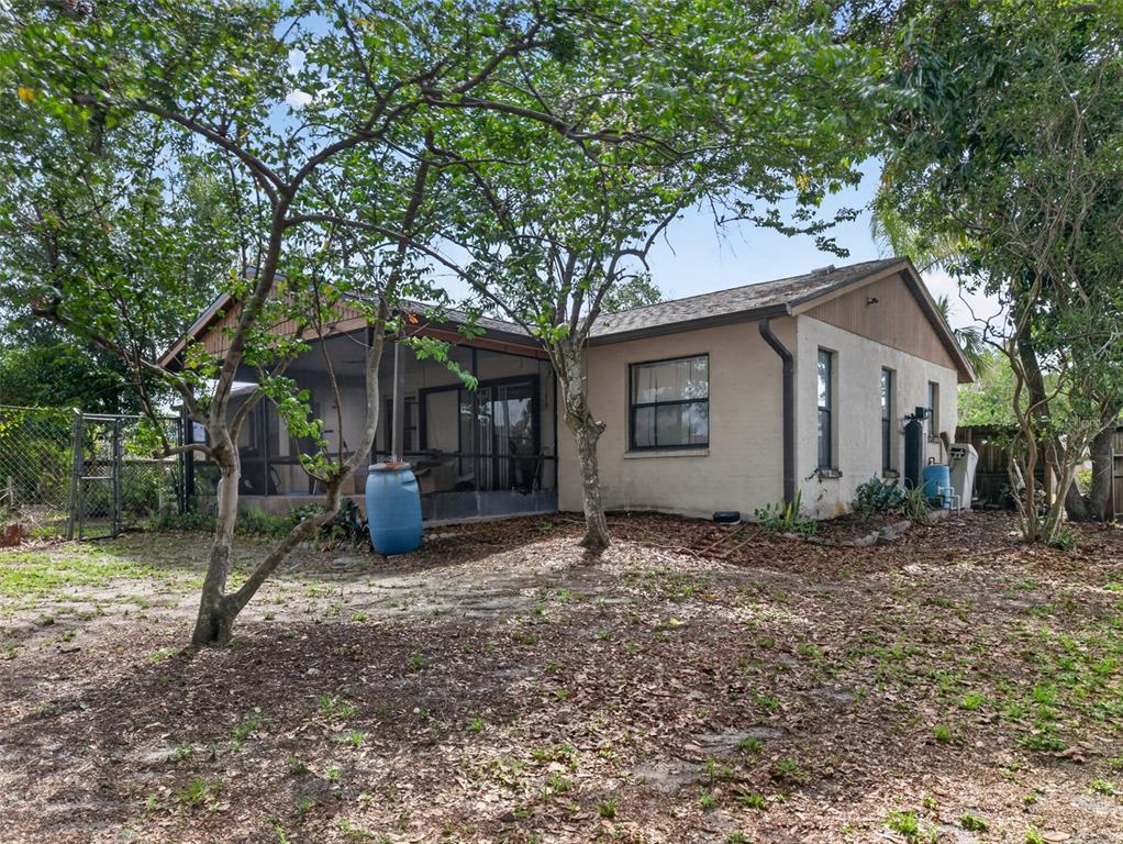 464 Coronado Road Venice, FL 34293 - Photo 19 of 28 a view of a house with a yard and large tree