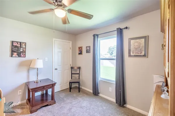 a view of room with window and furniture