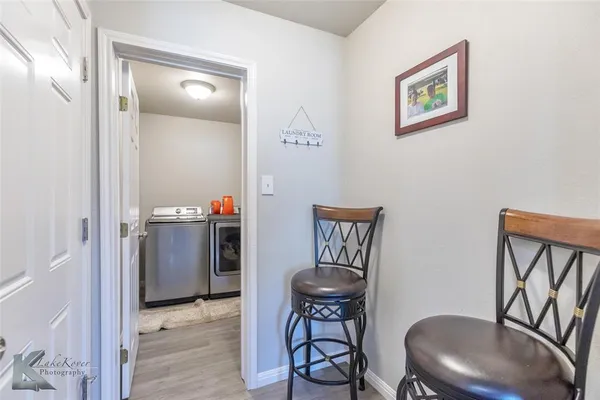 a workspace room with furniture and wooden floor