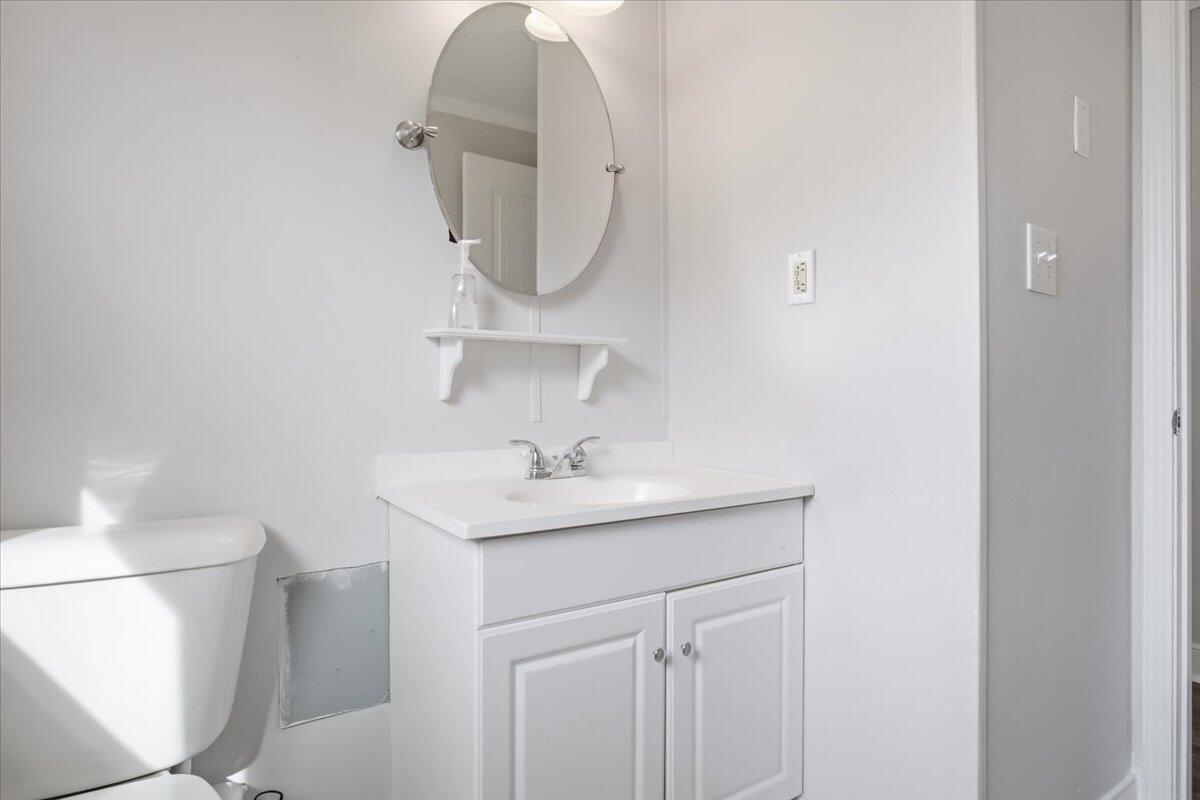 1249 Blue Ridge Turnpike Fincastle, VA 24090 - Photo 17 of 29 a bathroom with a sink a toilet and a mirror