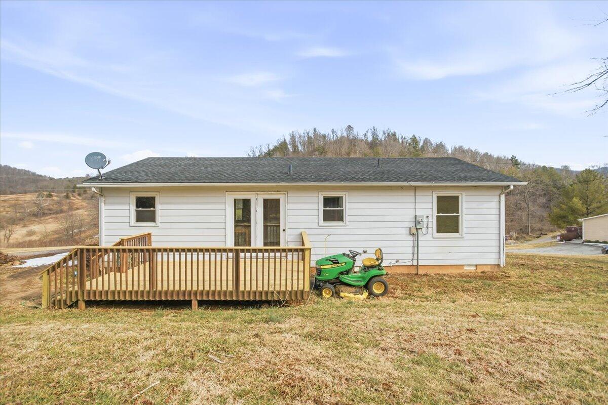 1249 Blue Ridge Turnpike Fincastle, VA 24090 - Photo 26 of 29 a view of a house with a patio and a yard