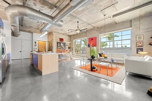 a view of hallway with stairs and furniture