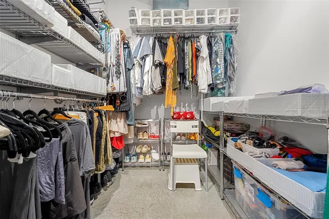 a living room with furniture a flat screen tv and large window