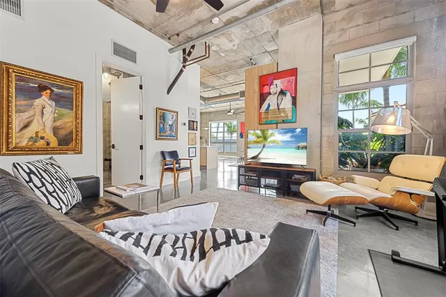a bathroom with a granite countertop sink a toilet and a mirror