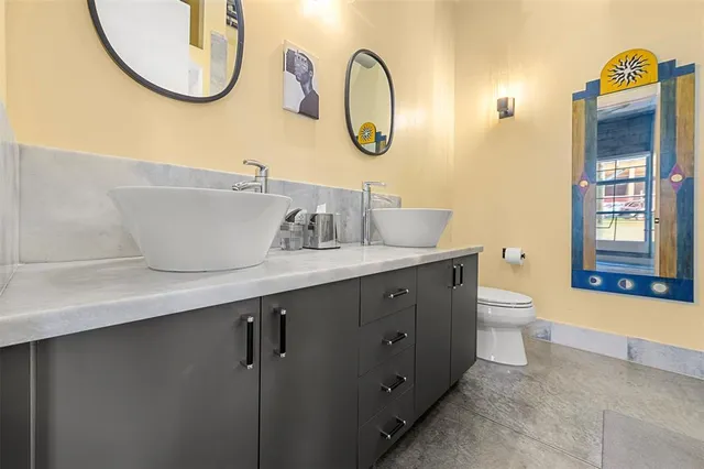 a bathroom with a shower and a sink