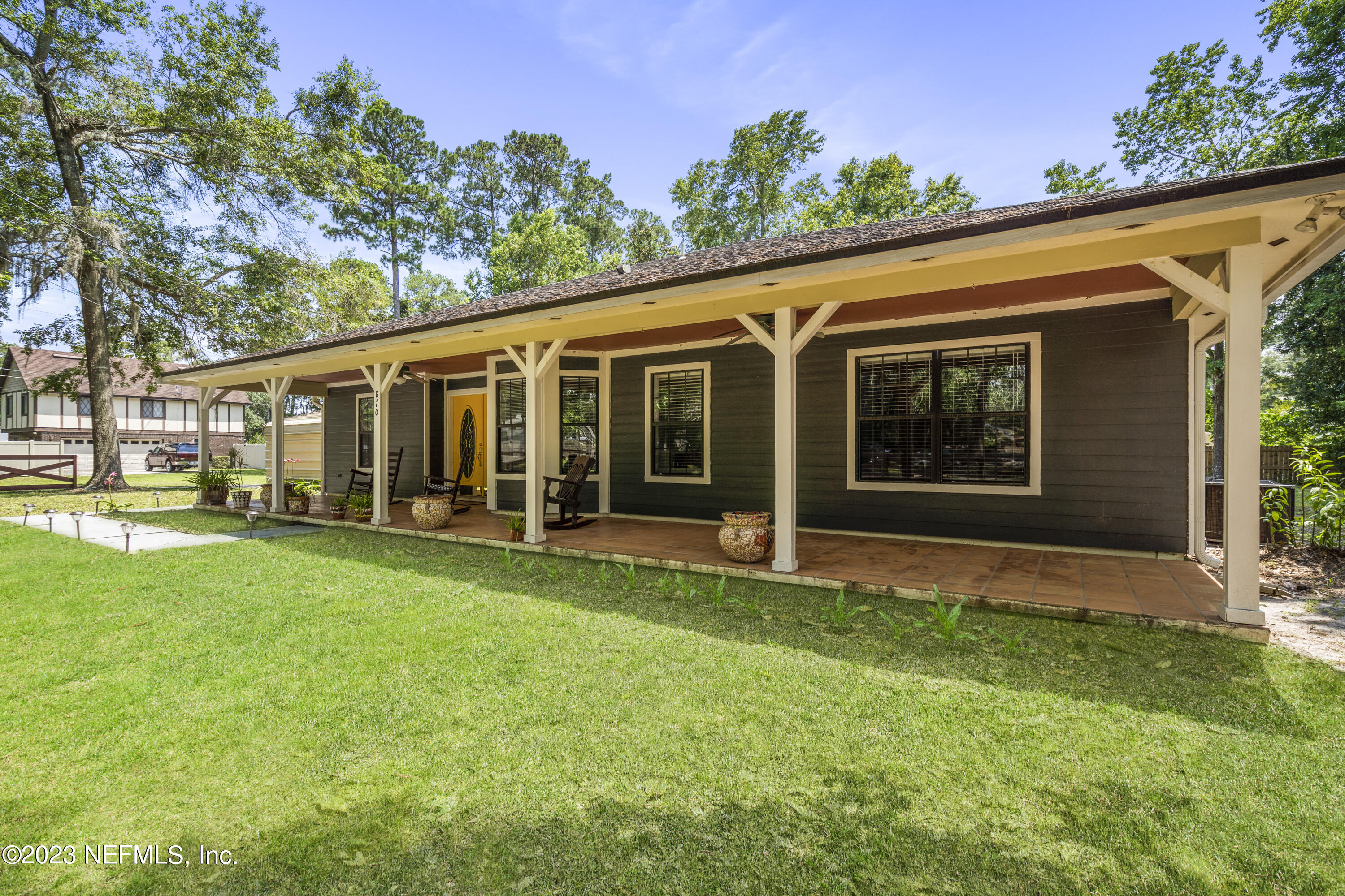 870 Fleming Street Fleming Island, FL 32003 - Photo 2 of 48 a view of a house with backyard porch and garden