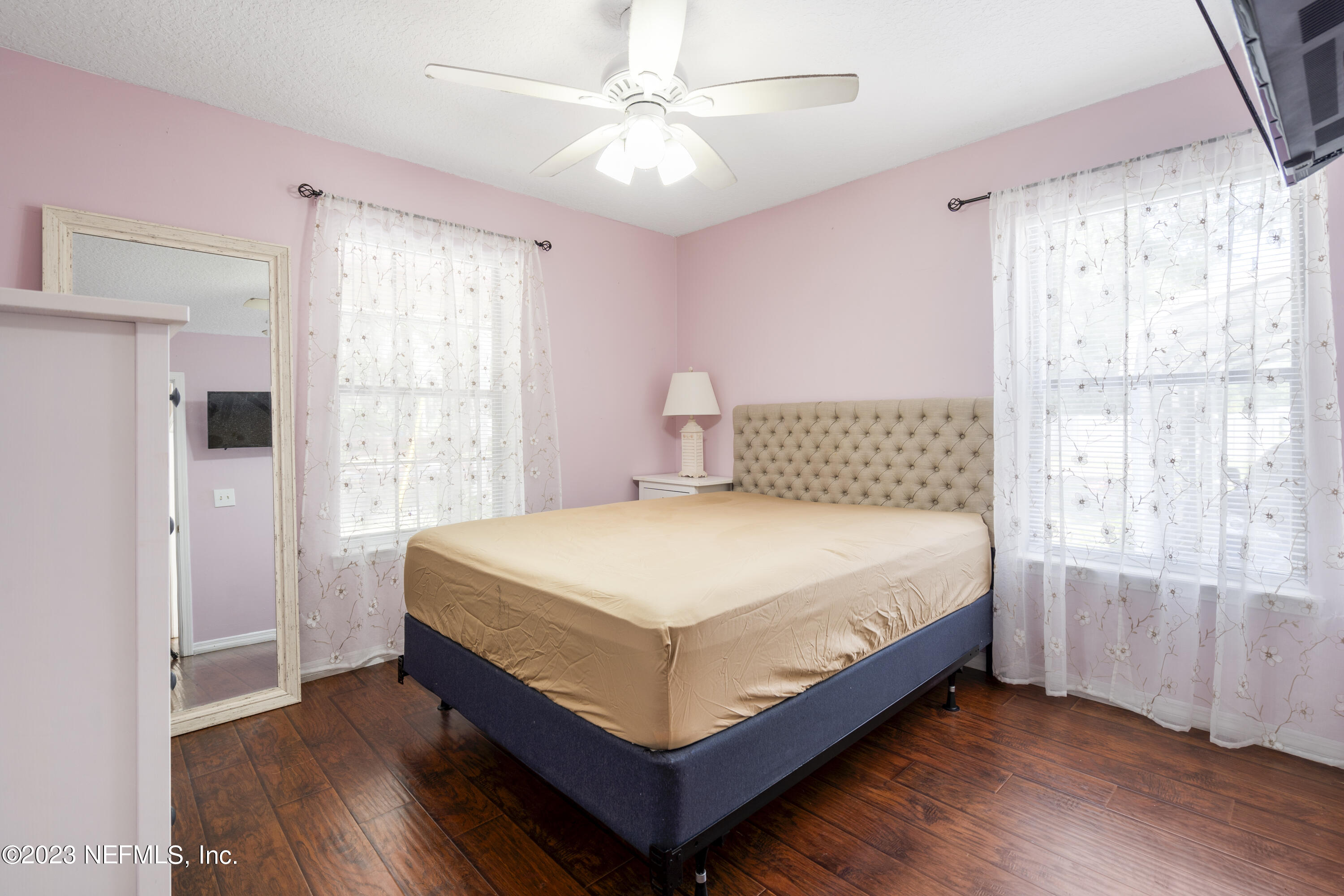 870 Fleming Street Fleming Island, FL 32003 - Photo 22 of 48 a bedroom with a bed and a window