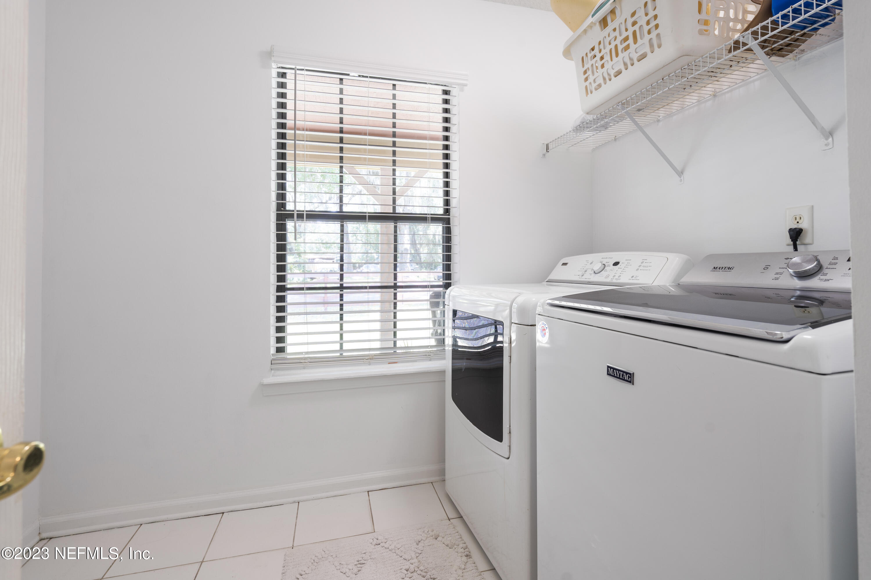 870 Fleming Street Fleming Island, FL 32003 - Photo 30 of 48 a utility room with dryer and washer