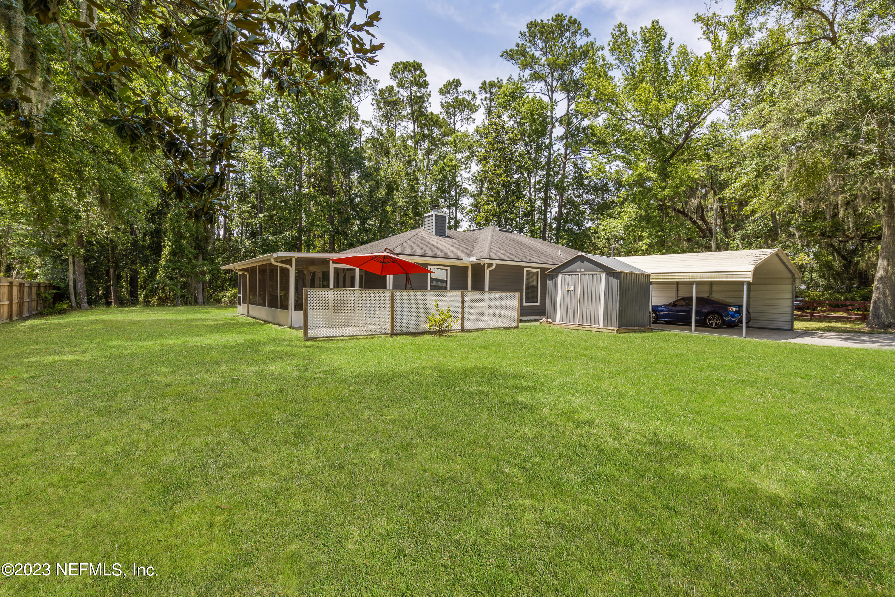 870 Fleming Street Fleming Island, FL 32003 - Photo 34 of 48 a view of a house with a backyard