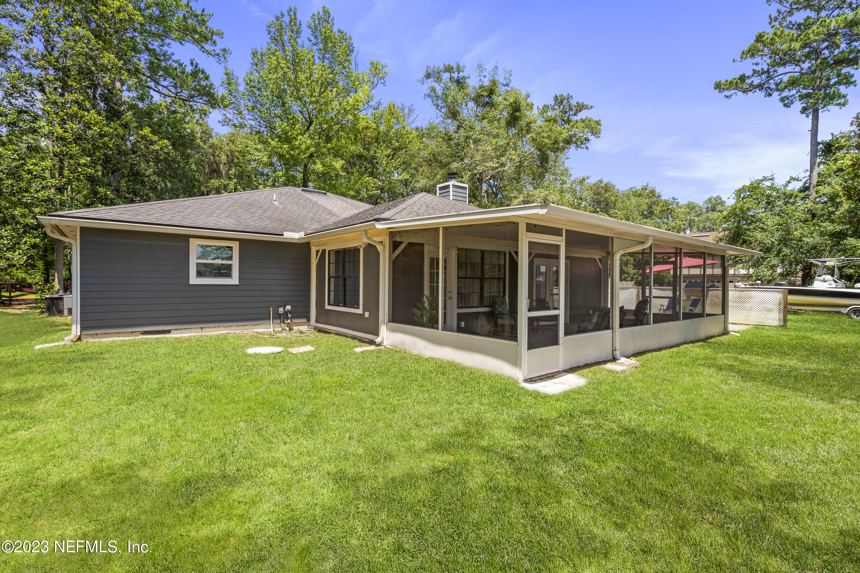 870 Fleming Street Fleming Island, FL 32003 - Photo 37 of 48 a view of a house with a yard