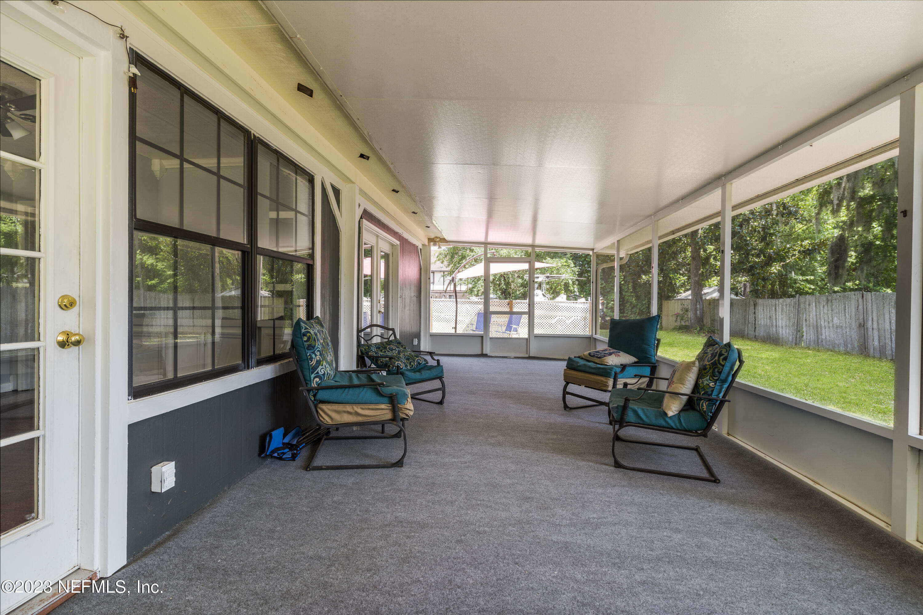 870 Fleming Street Fleming Island, FL 32003 - Photo 41 of 48 a living room with furniture and a garden