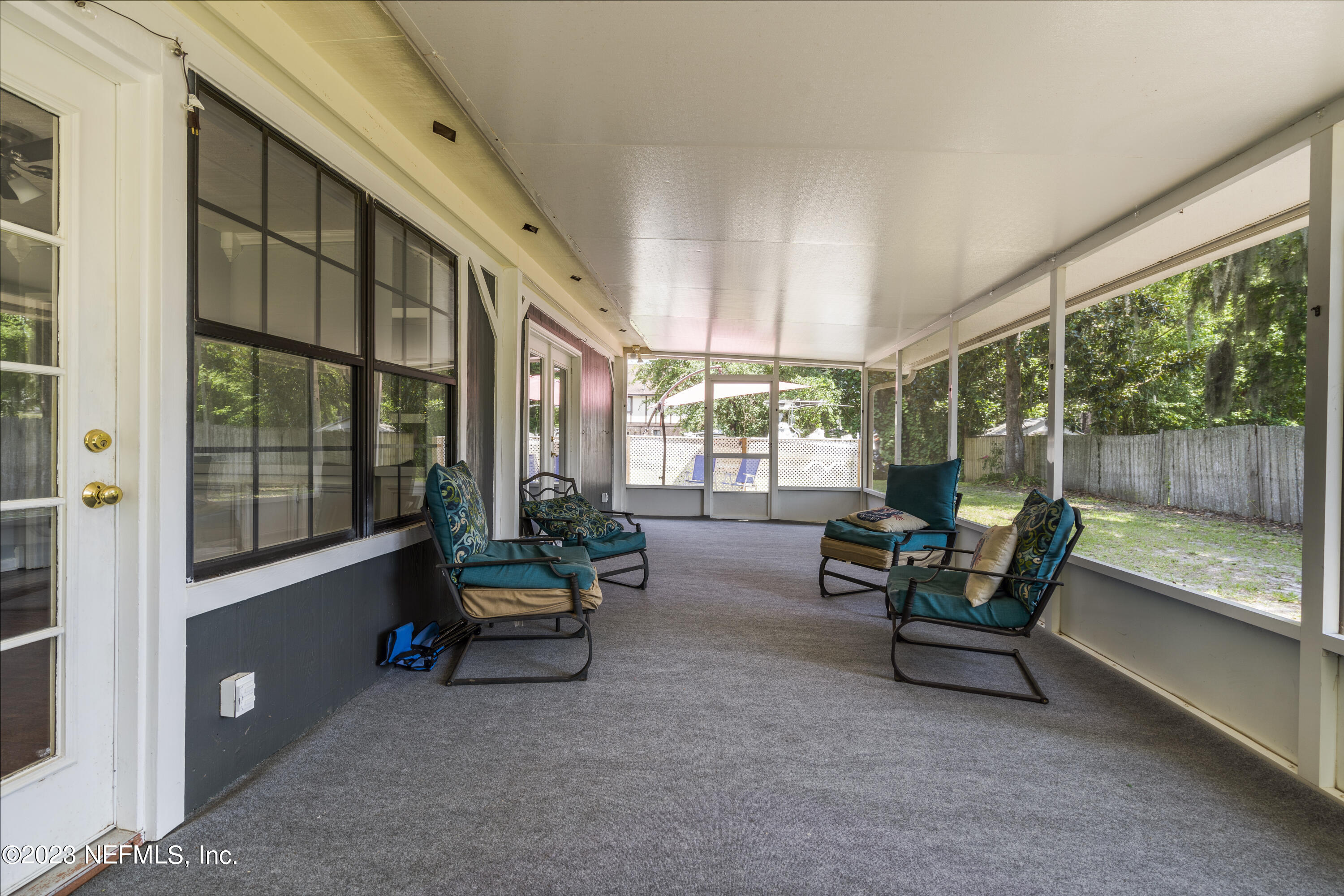 870 Fleming Street Fleming Island, FL 32003 - Photo 42 of 48 a living room with furniture and a large window