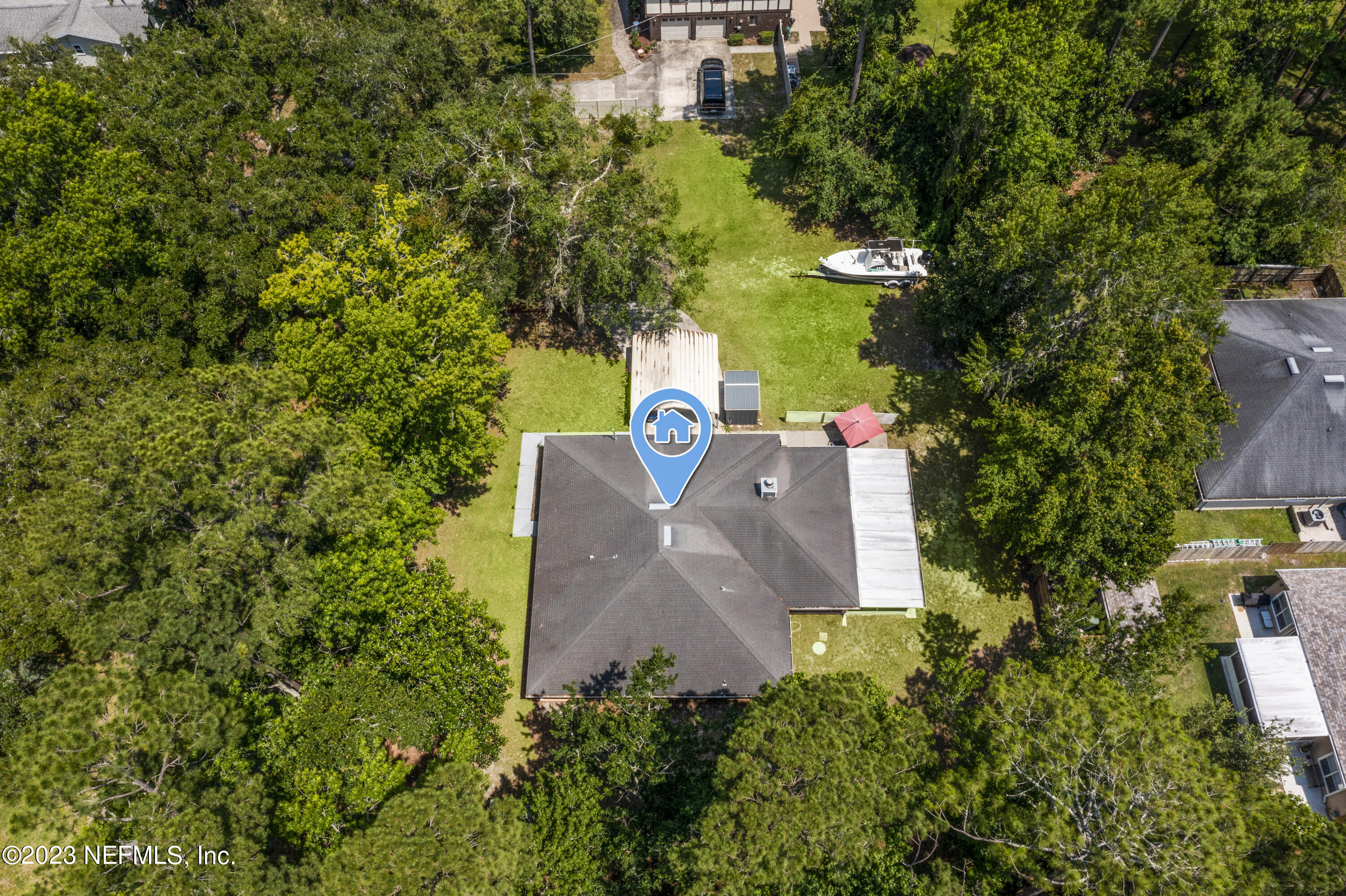 870 Fleming Street Fleming Island, FL 32003 - Photo 48 of 48 an aerial view of a house with outdoor space and trees all around