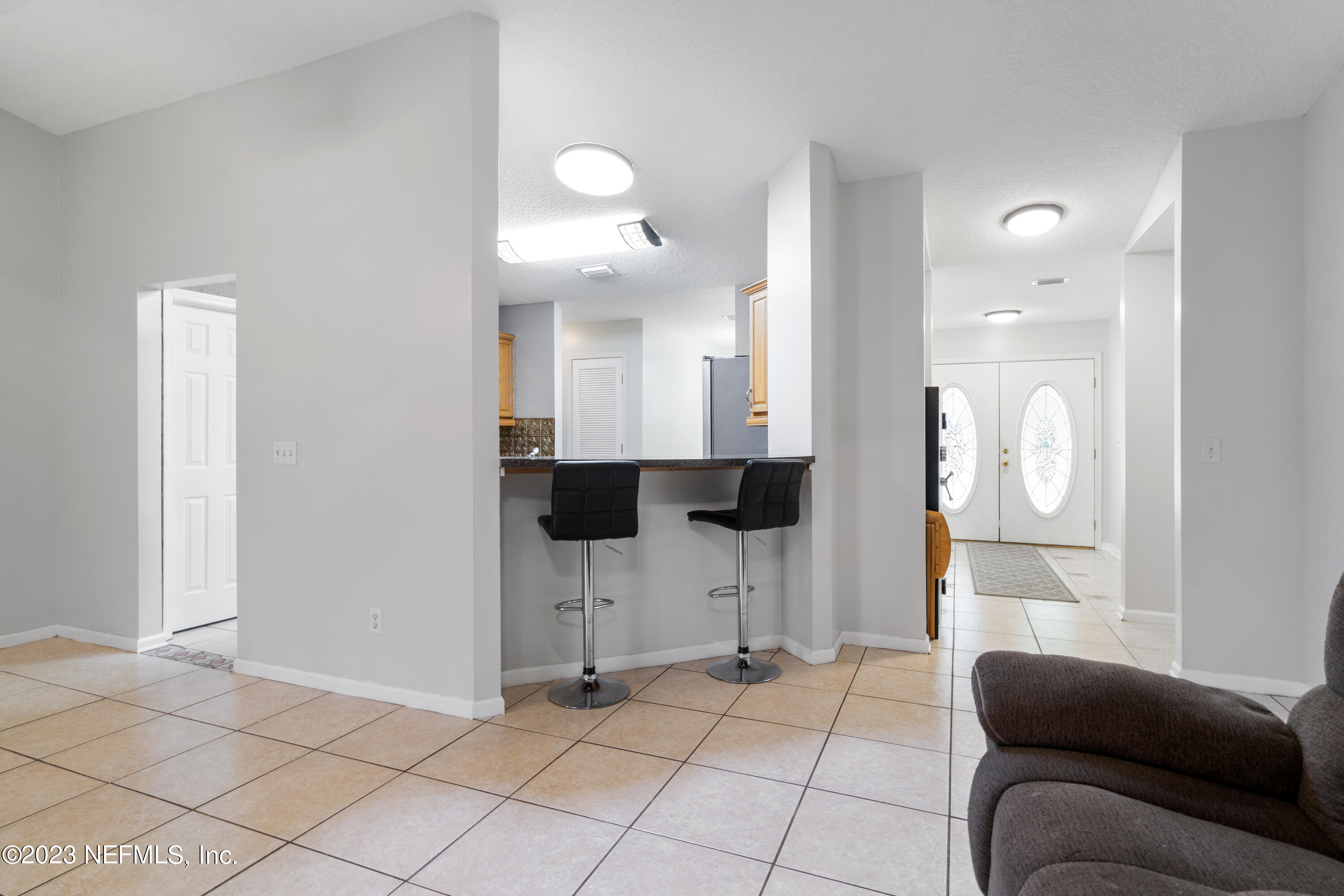 870 Fleming Street Fleming Island, FL 32003 - Photo 7 of 48 a view of kitchen with furniture and window