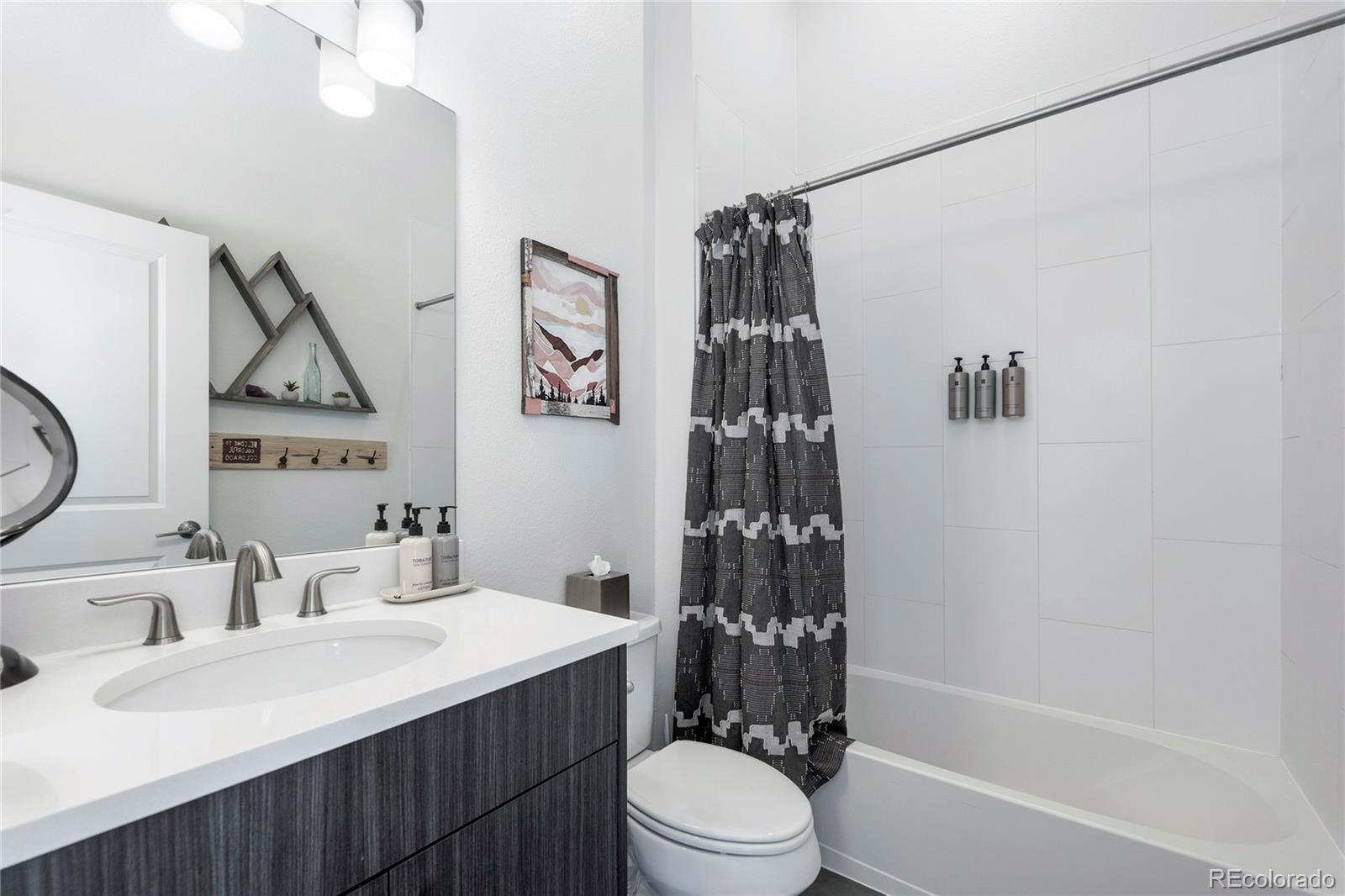 40 Journey Way Fraser, CO 80442 - Photo 23 of 41 a bathroom with a sink a toilet and shower