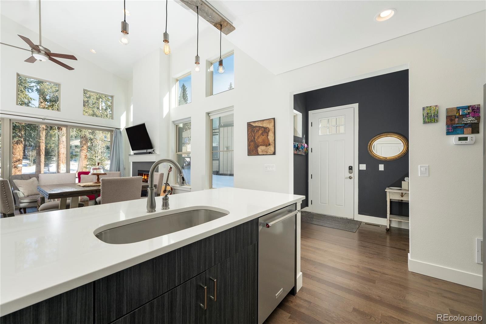 40 Journey Way Fraser, CO 80442 - Photo 5 of 41 a kitchen with sink cabinets and chandelier