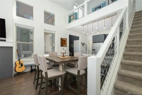 a view of hall way with furniture and stairs