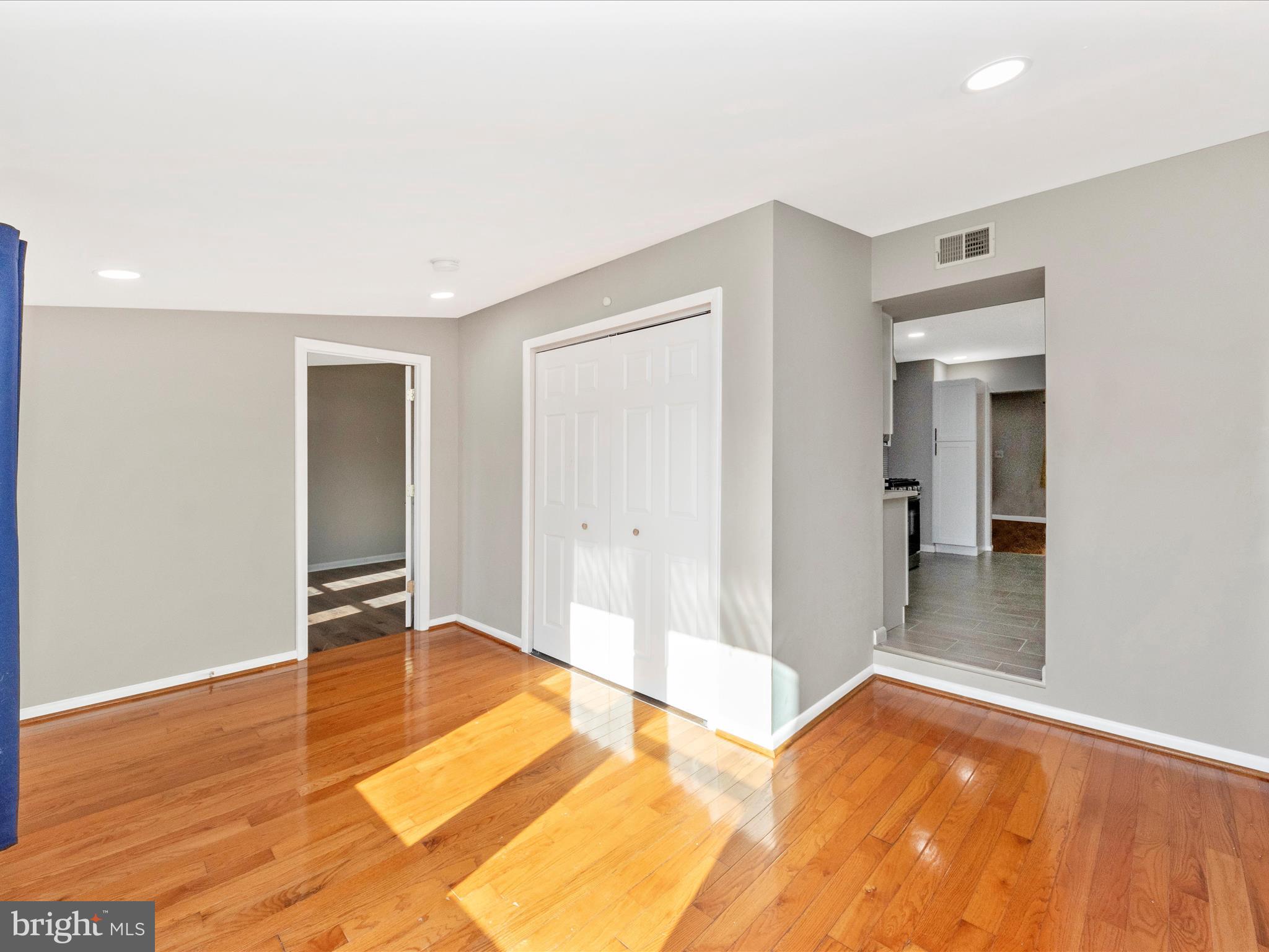 1203 North Point Road Dundalk, MD 21222 - Photo 22 of 42 a view of a bedroom with wooden floor and bathroom