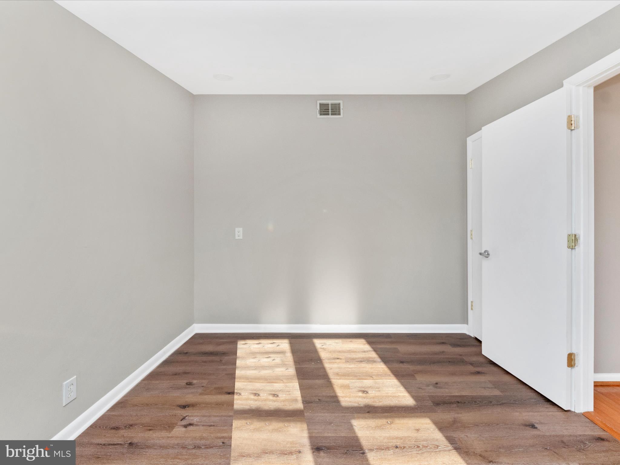 1203 North Point Road Dundalk, MD 21222 - Photo 26 of 42 an empty room with wooden floor