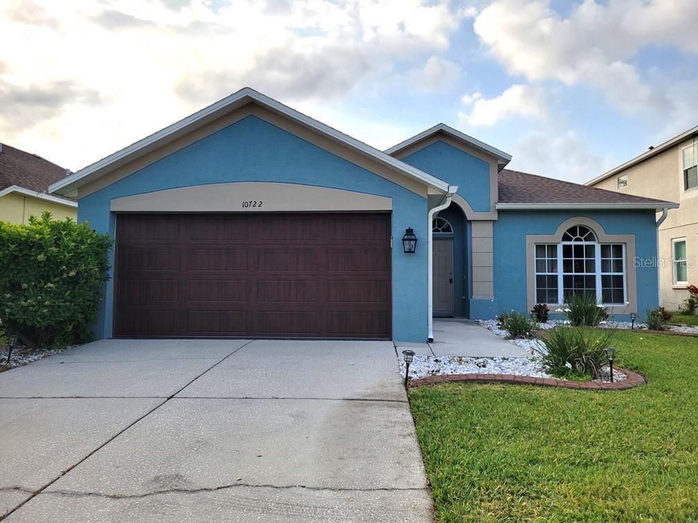 10722 Firebrick Court Trinity, FL 34655 - Photo 1 of 1 a front view of house with yard and green space