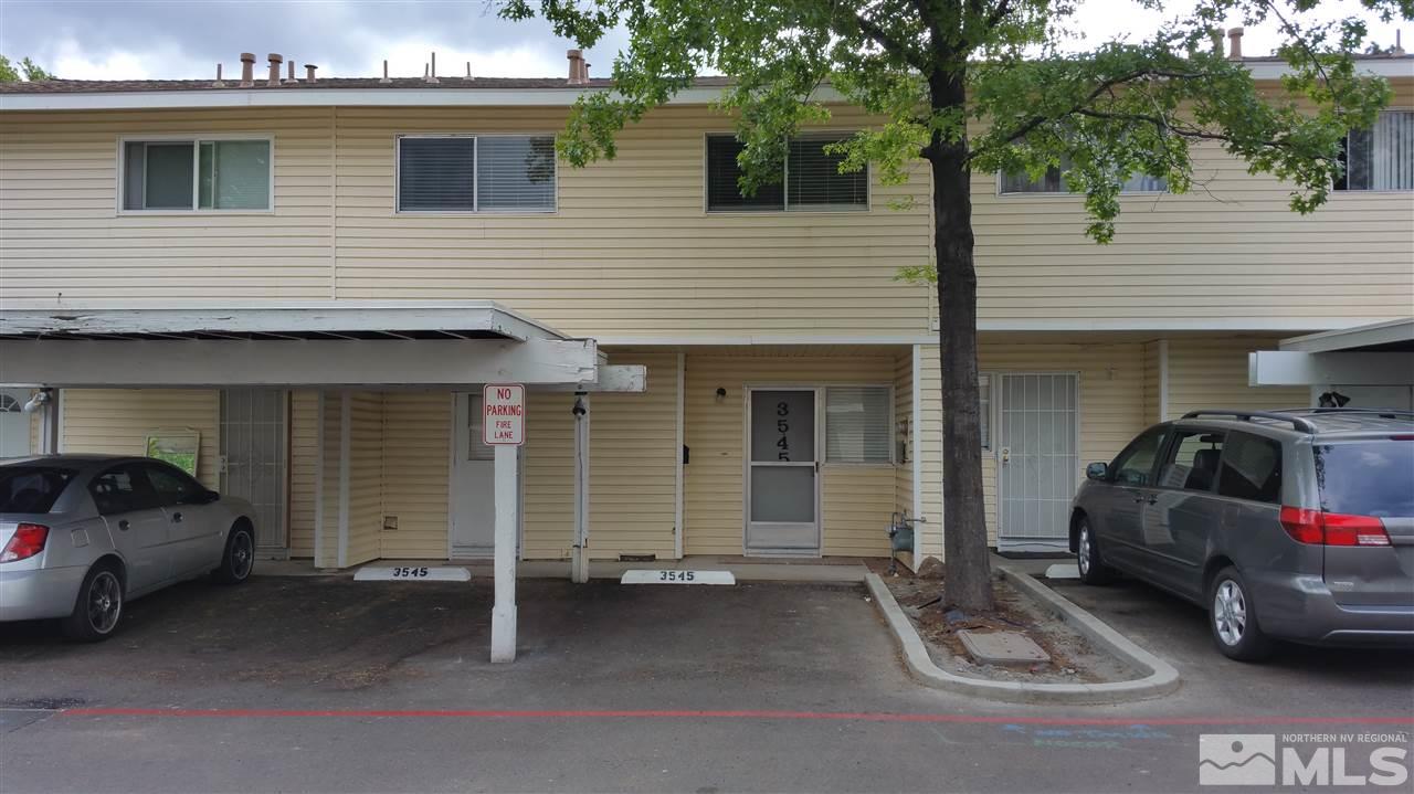 a view of a car park in front of house