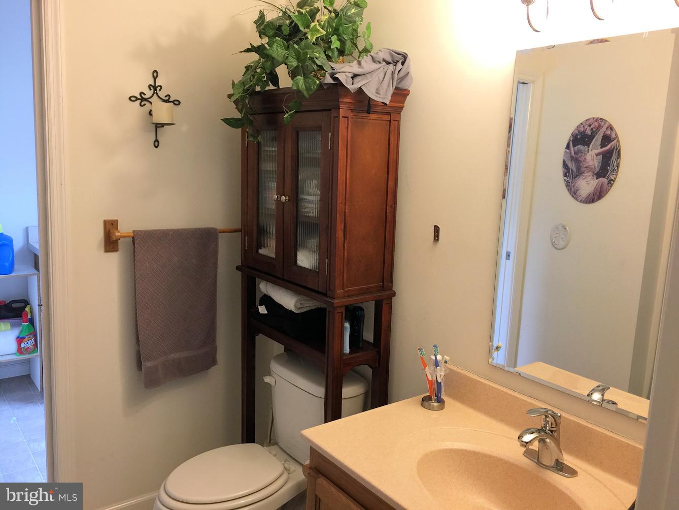 2441 Ridge Road Baltimore, MD 21244 - Photo 11 of 19 a bathroom with a toilet sink and shower