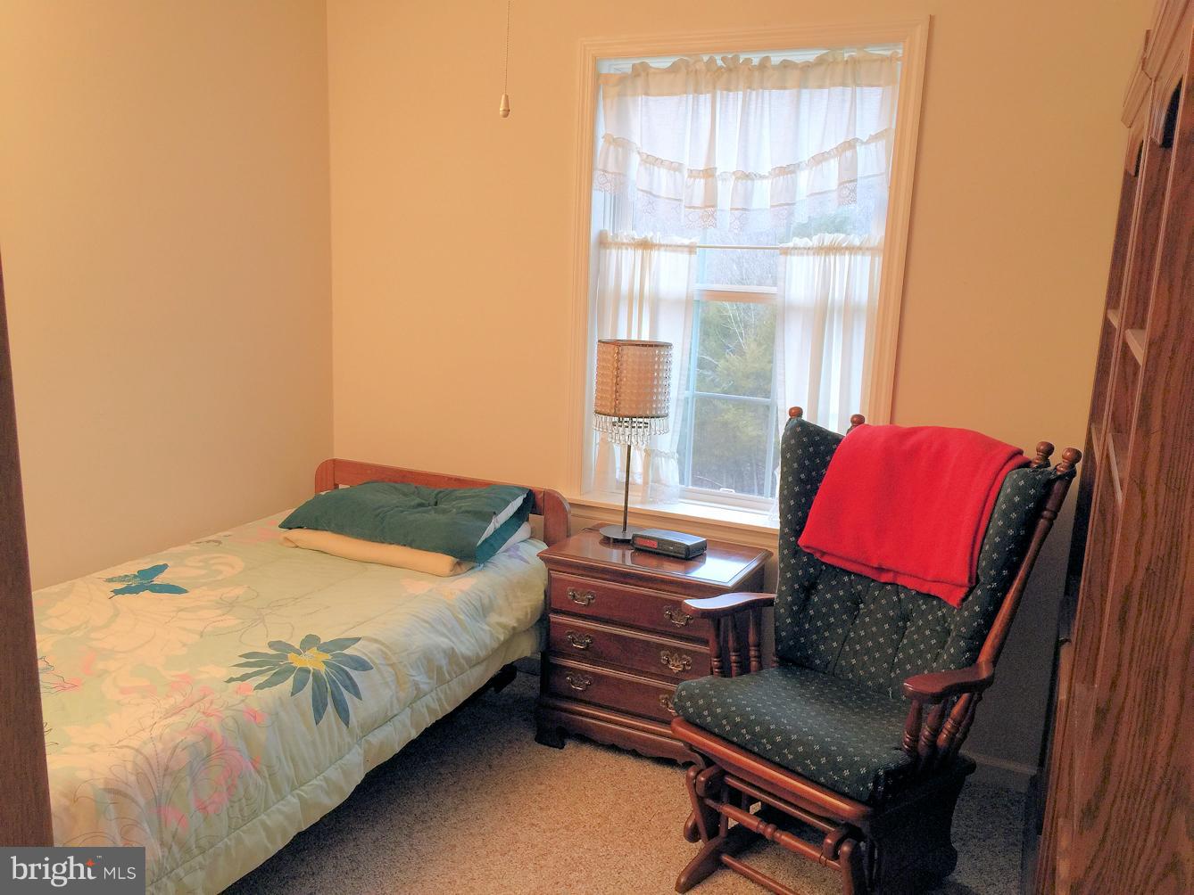 2441 Ridge Road Baltimore, MD 21244 - Photo 13 of 19 a bedroom with a bed and window