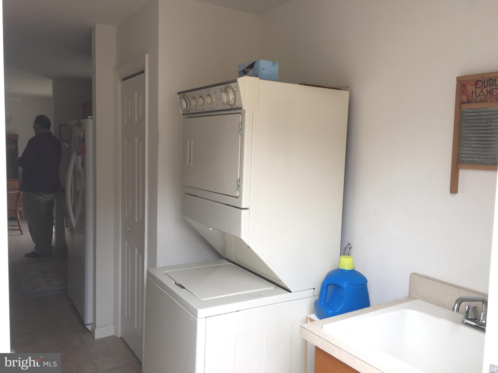 2441 Ridge Road Baltimore, MD 21244 - Photo 14 of 19 a white refrigerator freezer and a sink