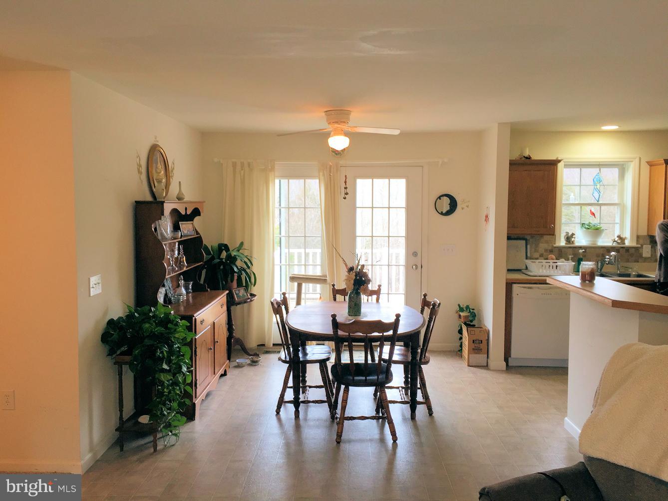 2441 Ridge Road Baltimore, MD 21244 - Photo 5 of 19 a view of a a dining room with furniture window and wooden floor