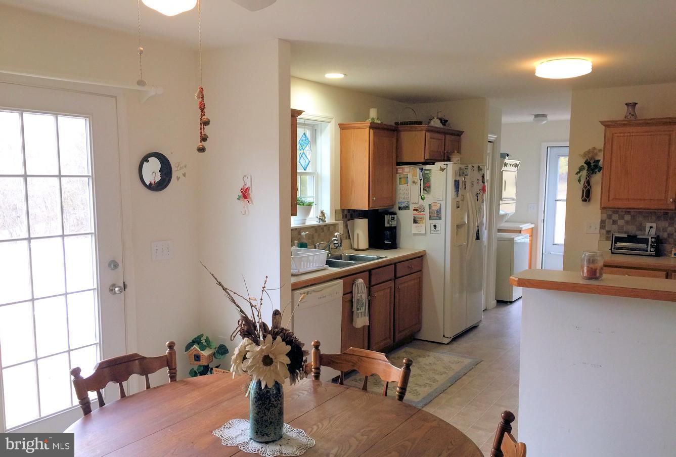 2441 Ridge Road Baltimore, MD 21244 - Photo 6 of 19 a kitchen with stainless steel appliances granite countertop a refrigerator and a sink