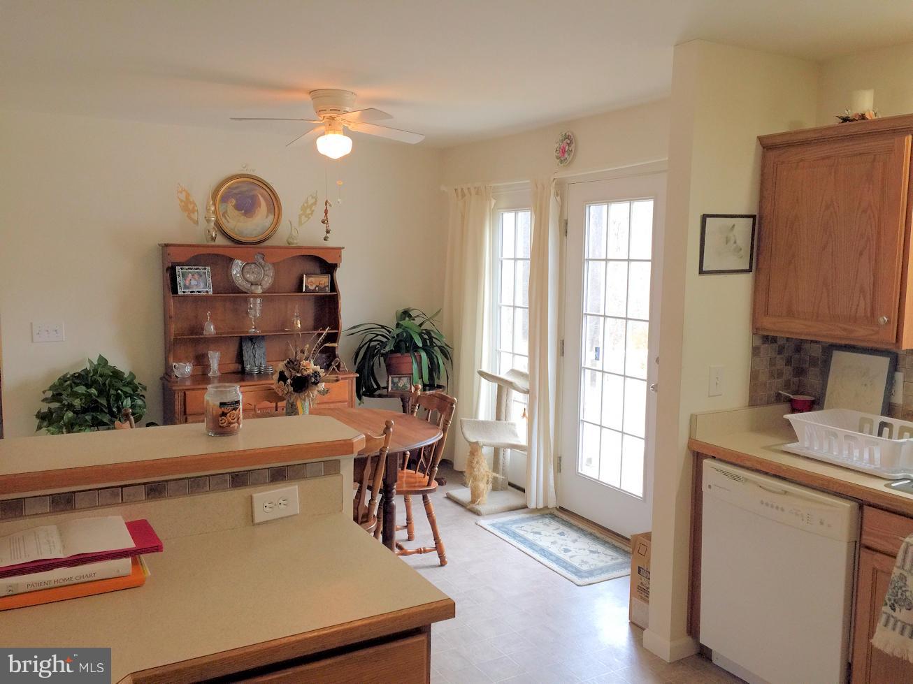 2441 Ridge Road Baltimore, MD 21244 - Photo 9 of 19 a view of a dining room with furniture window and wooden floor