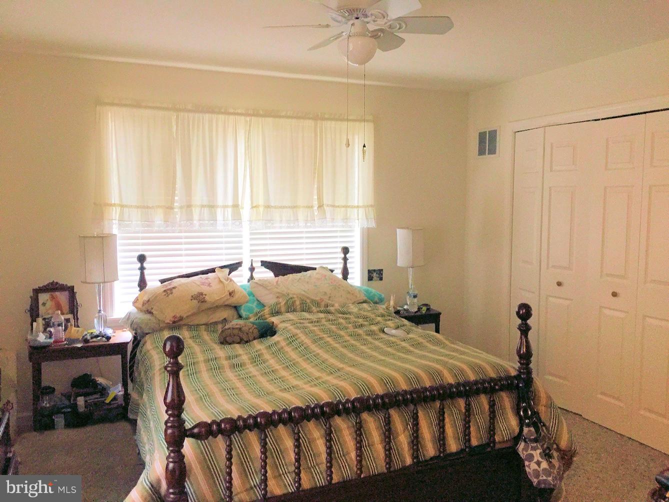 2441 Ridge Road Baltimore, MD 21244 - Photo 10 of 19 a bedroom with a bed and a window