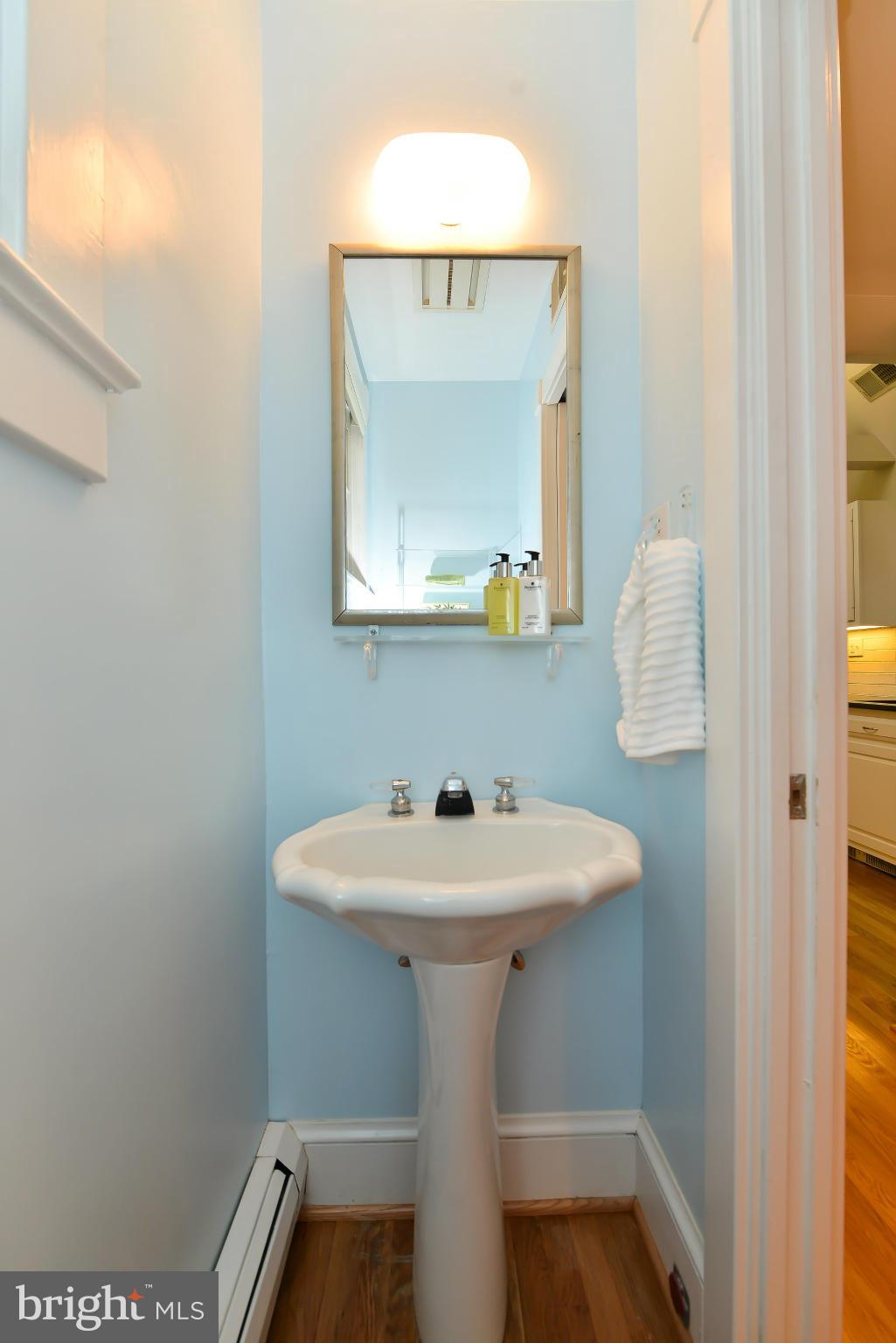 3339 Military Road Northwest Washington, DC 20015 - Photo 17 of 30 a bathroom with a sink and a mirror