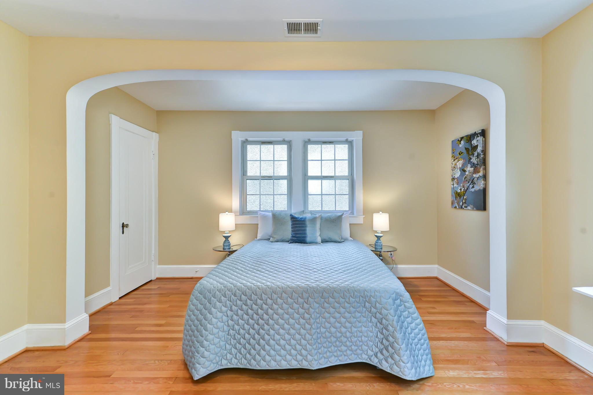 3339 Military Road Northwest Washington, DC 20015 - Photo 19 of 30 a bedroom with a bed and wooden floor