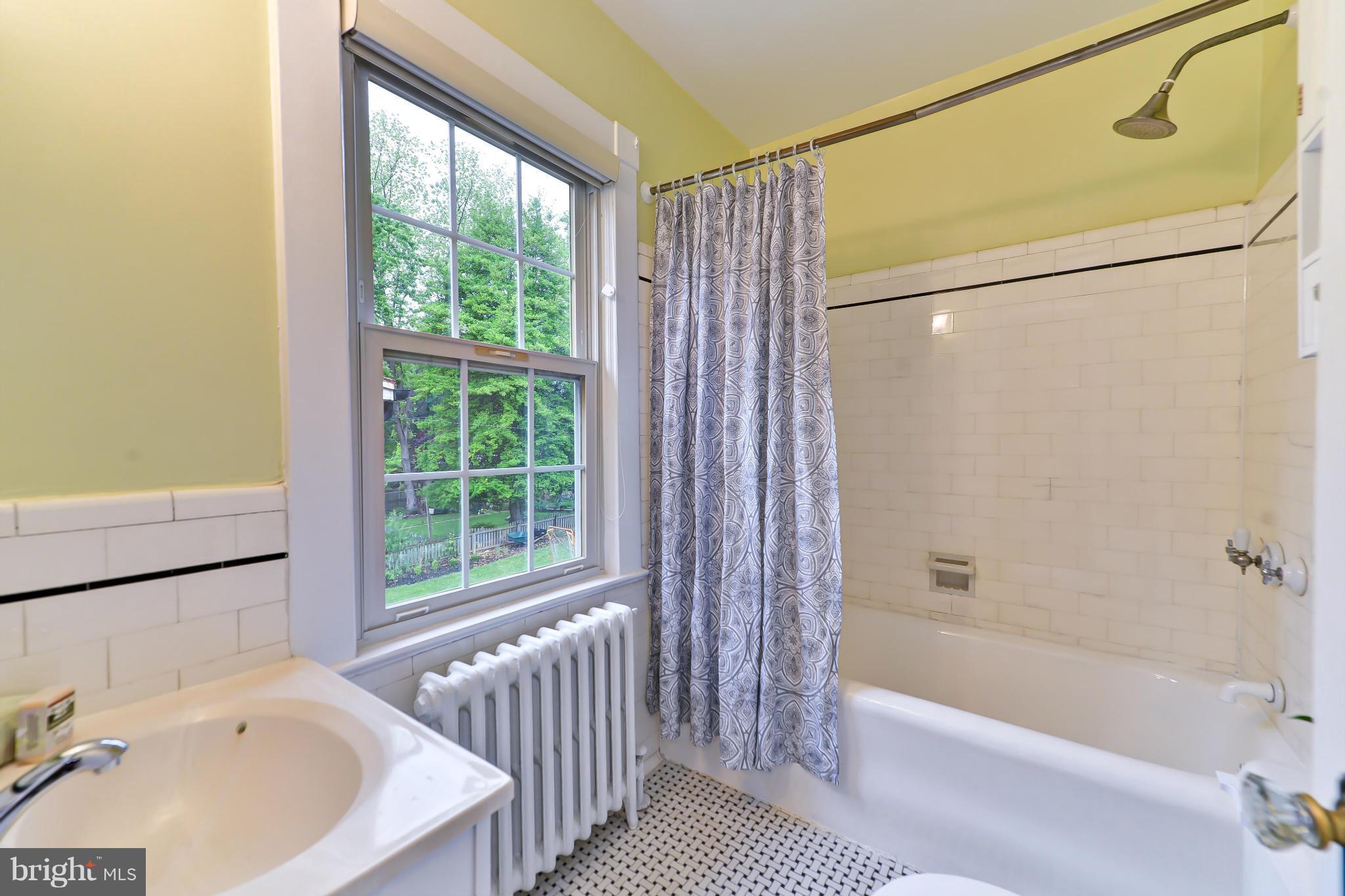 3339 Military Road Northwest Washington, DC 20015 - Photo 23 of 30 a bathroom with a bathtub and a shower