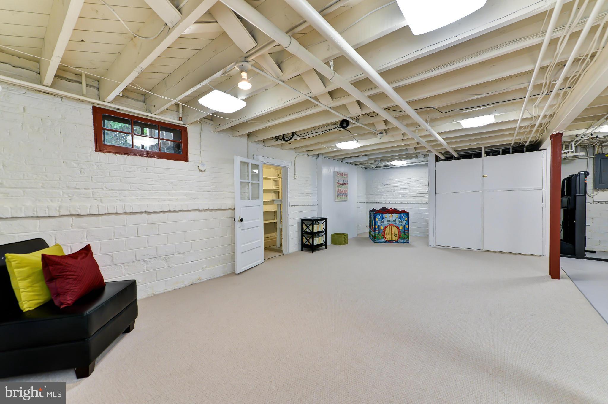 3339 Military Road Northwest Washington, DC 20015 - Photo 24 of 30 a view of a livingroom with furniture and a projector