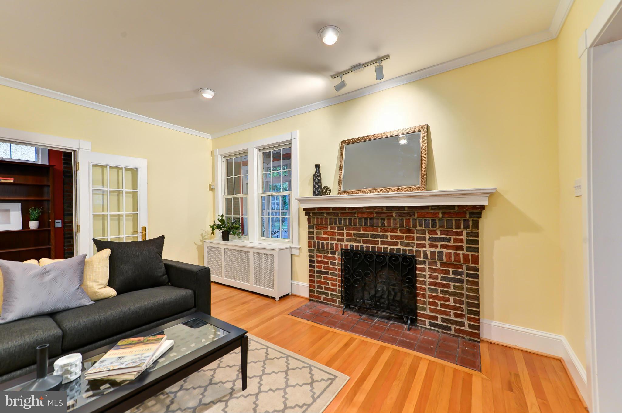 3339 Military Road Northwest Washington, DC 20015 - Photo 4 of 30 a living room with furniture and a fireplace